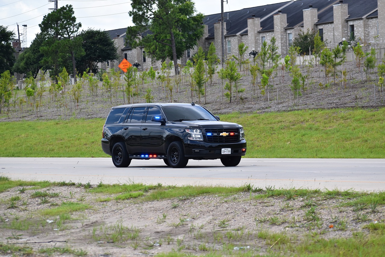 Unmarked police vehicle equipped with Voice Controller iMS for seamless control.